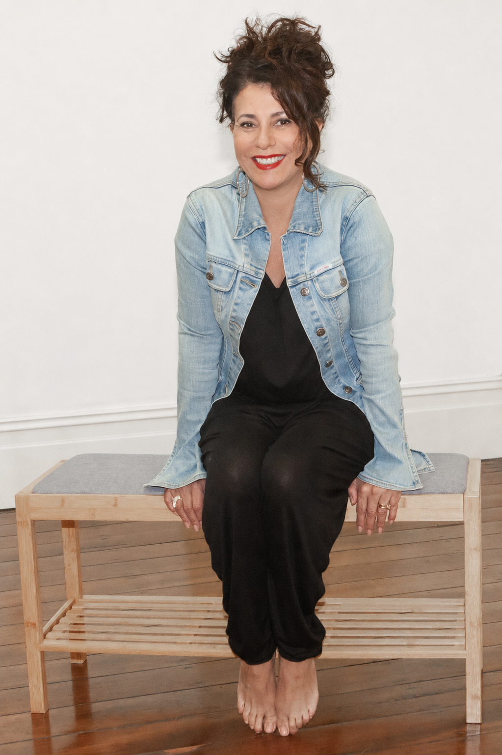 Tanya Harris, founder of Just Be Tribe, wearing a denim jacket